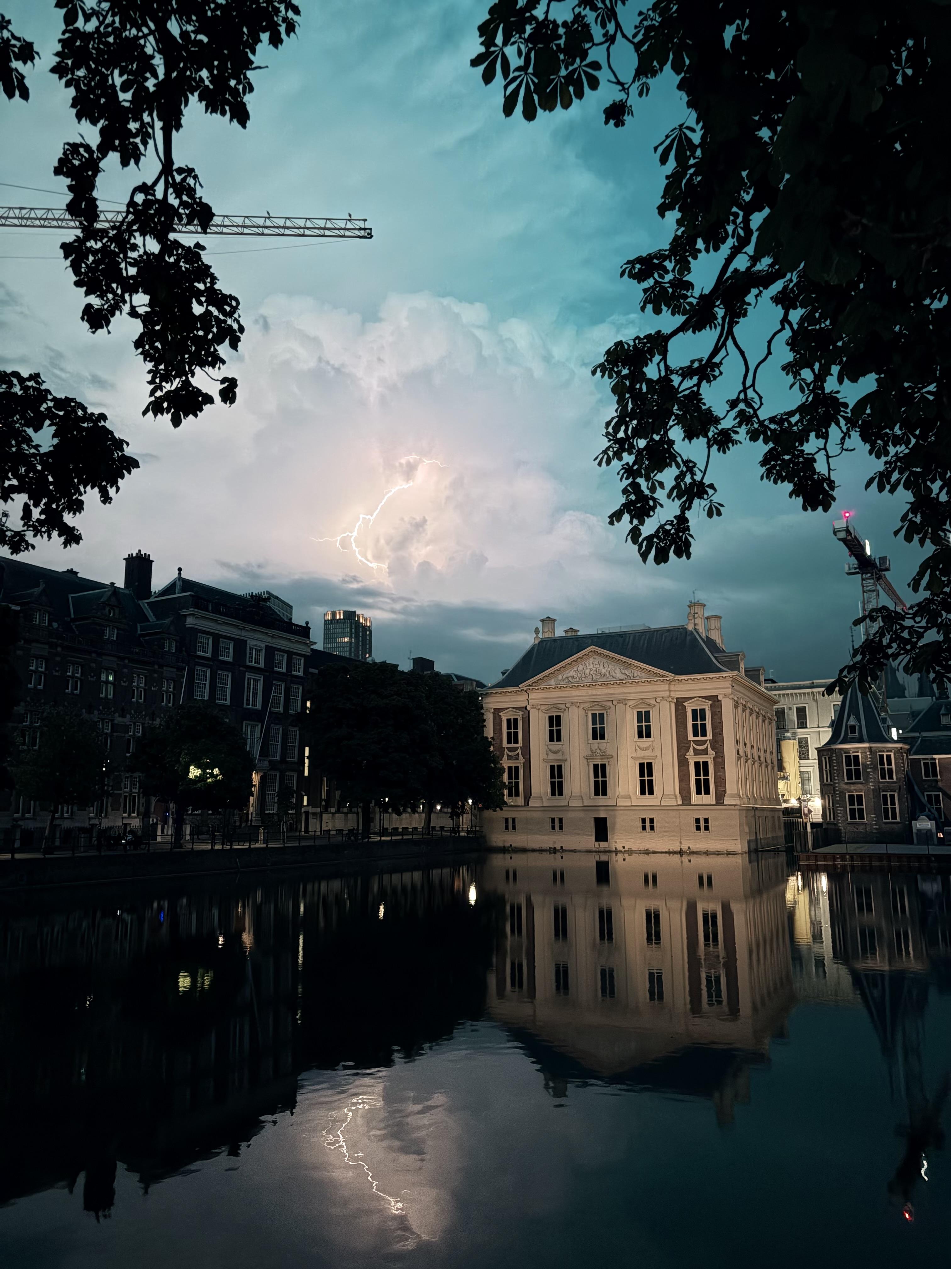 a lightning flash captured in the evening above the Mauritshuis in The Hague, Netherlands