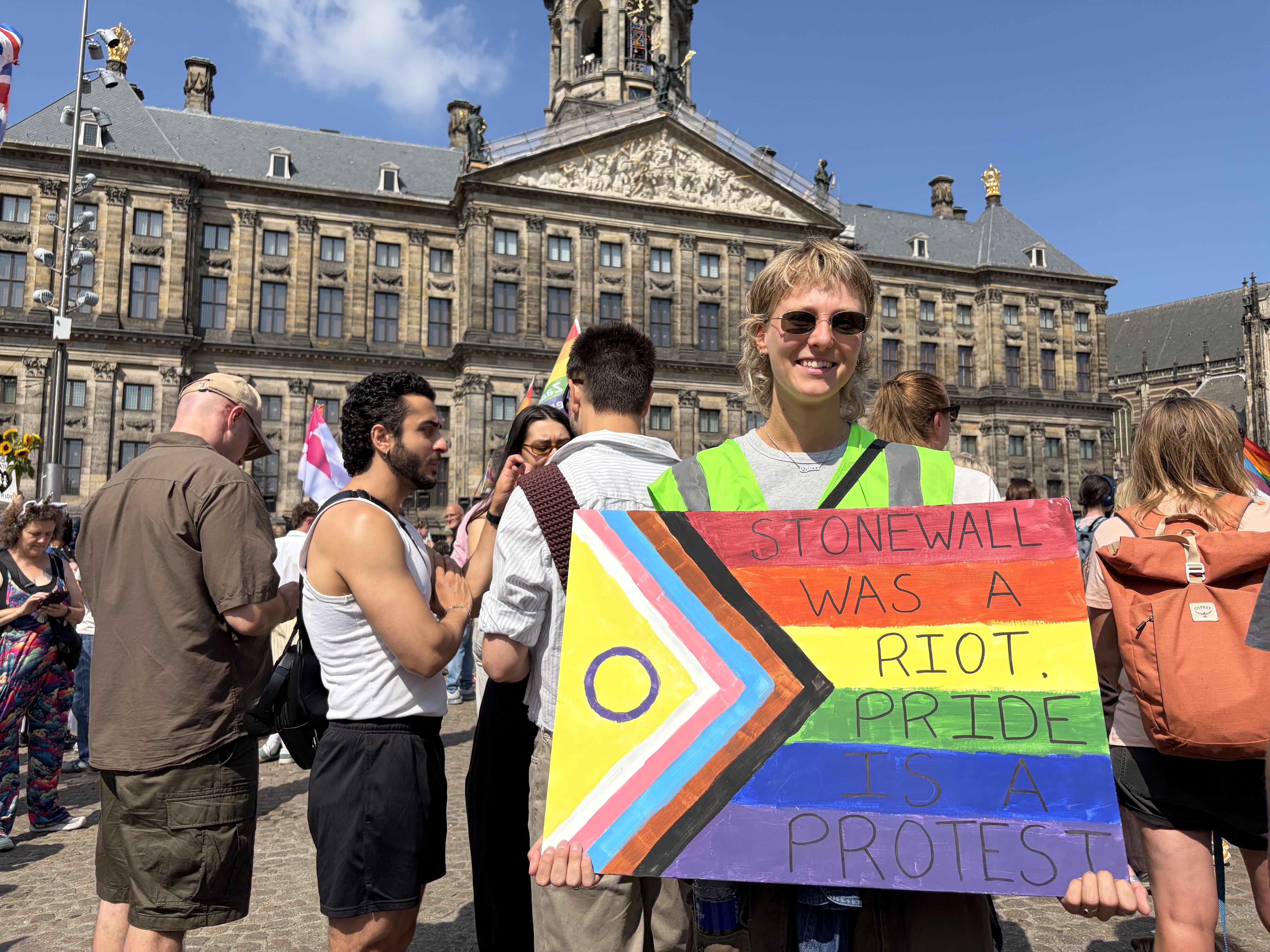 Stonewall was a Riot
Pride is a Protest
trans pride flag sign in Dams Square Amsterdam