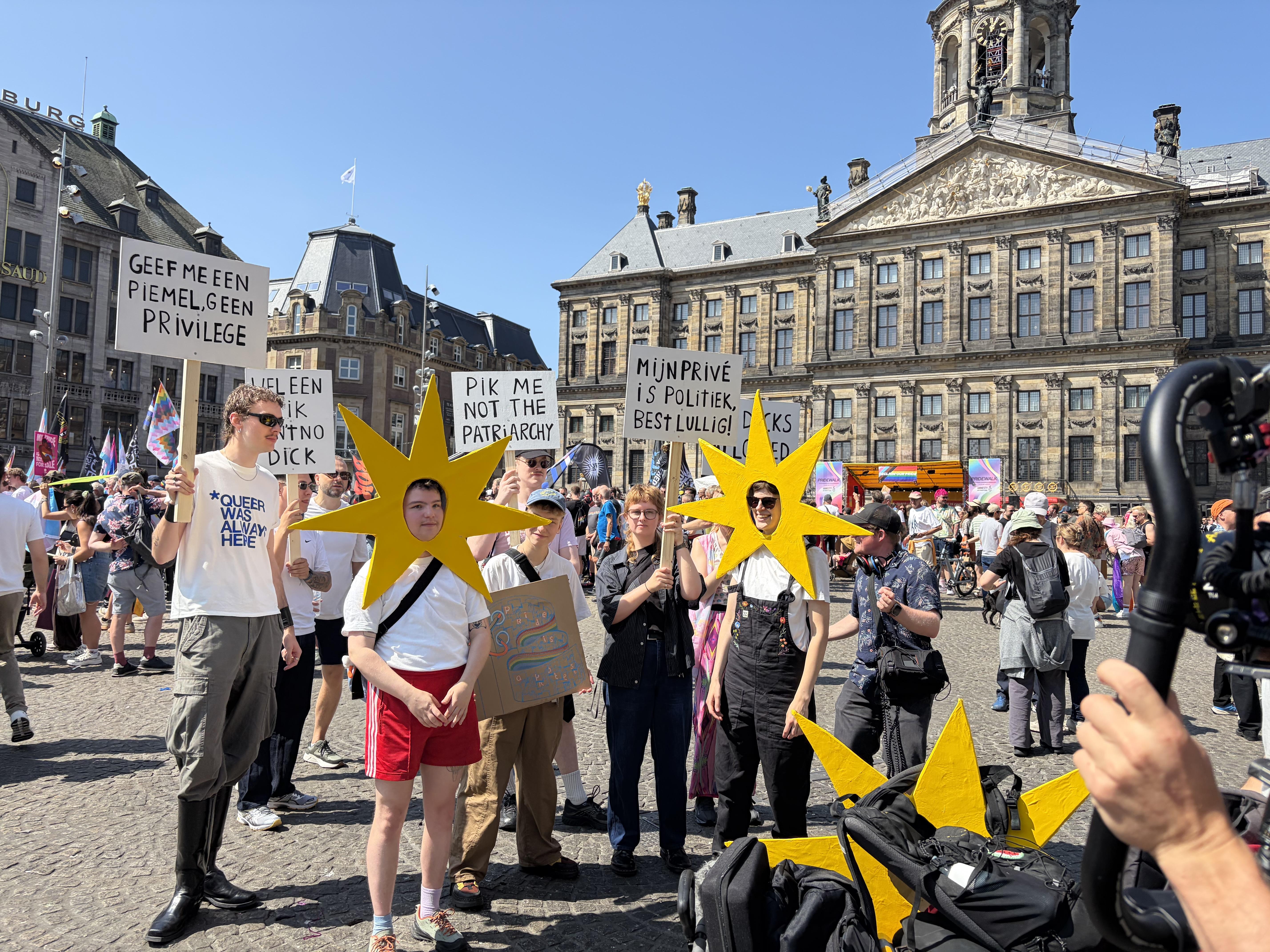 signs and sunshines outside Royal Palace Amsterdam in Dams Square