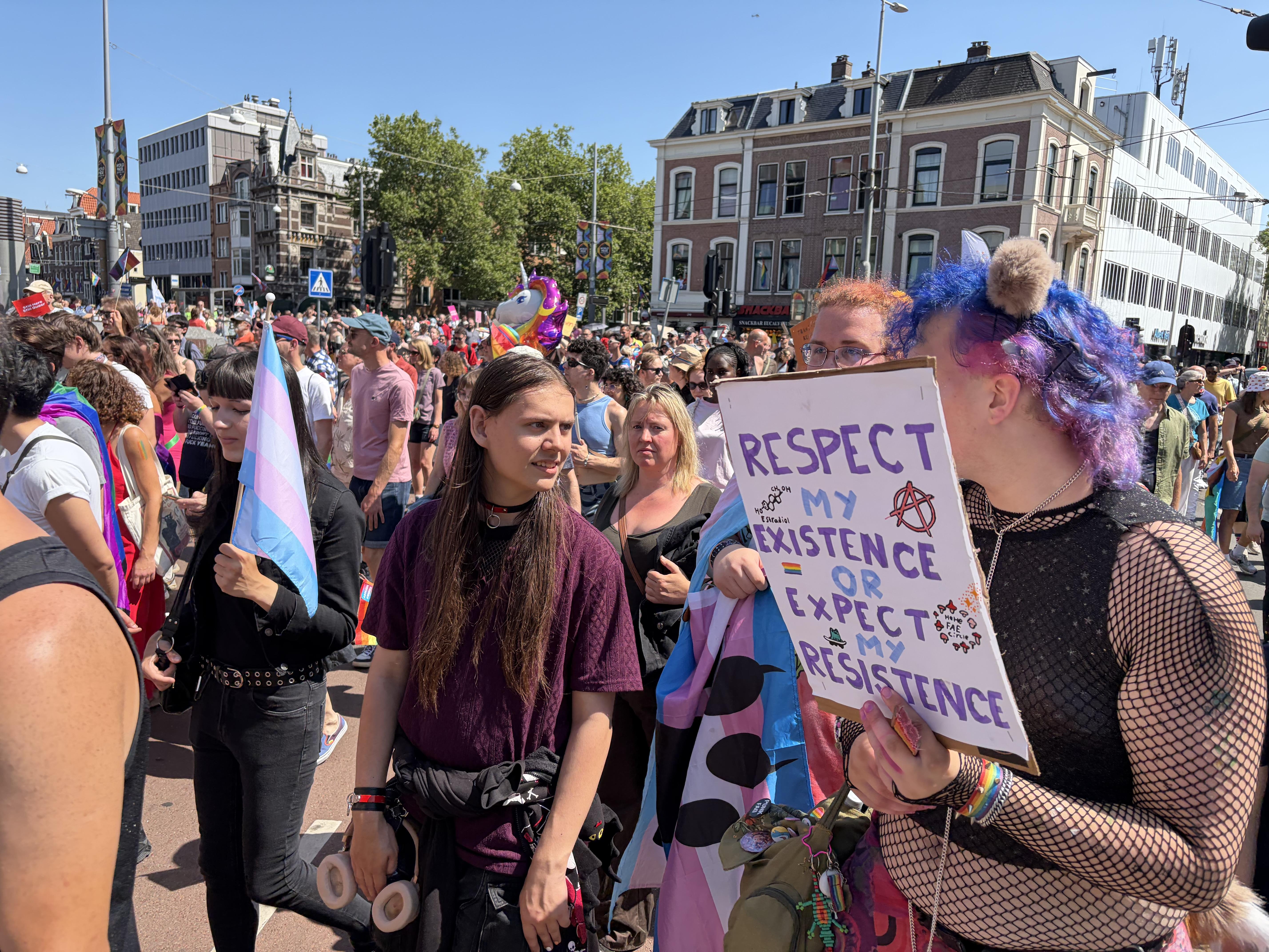 Pride Walk Amsterdam, sign says "Respect my existence or expect resistance"